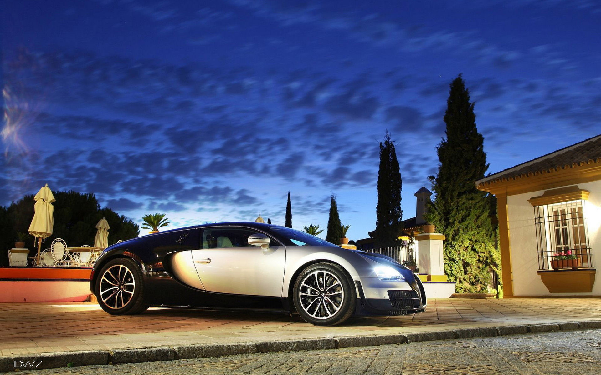 1920x1200 bugatti veyron in front of a mansion at sunset wallpaper