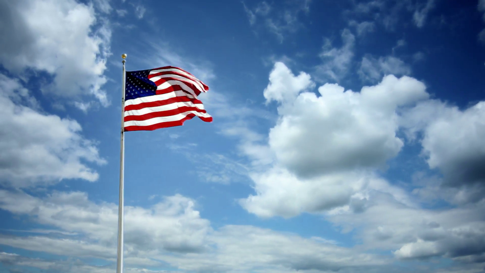1920x1080 American Flag waving in slow motion on beautiful timelapse blue sky and  cloud background