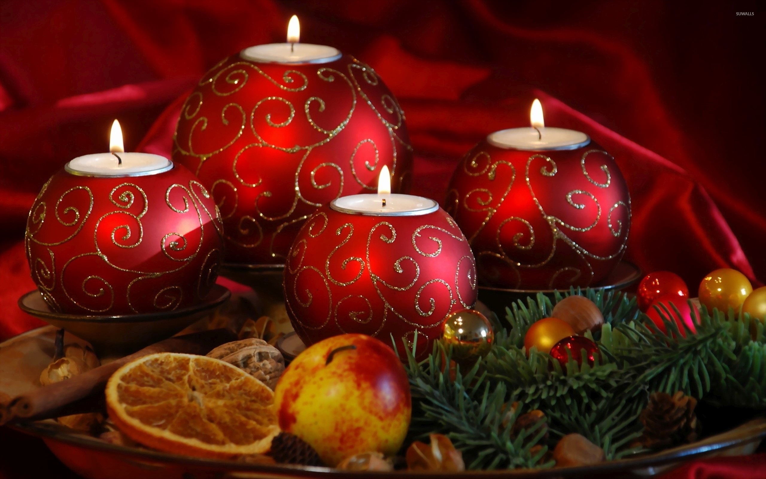 2560x1600 Red Christmas candles on a plate wallpaper