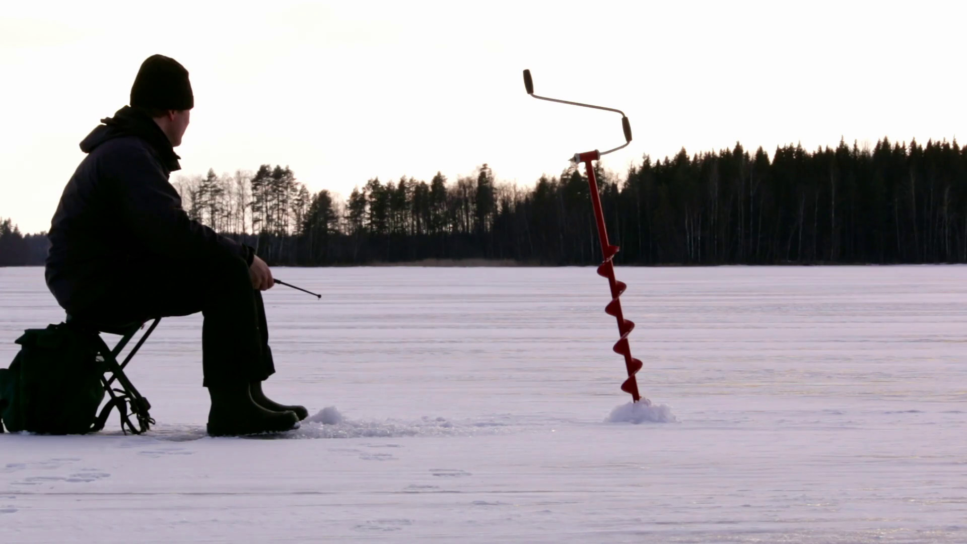 1920x1080 Fisherman ice fishing at a Nordic lake Stock Video Footage - Storyblocks  Video