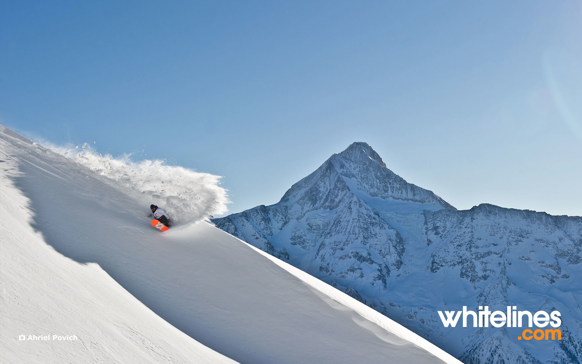 1920x1200 Snowboard Wallpaper – Martin Seiler slashes Swiss snow