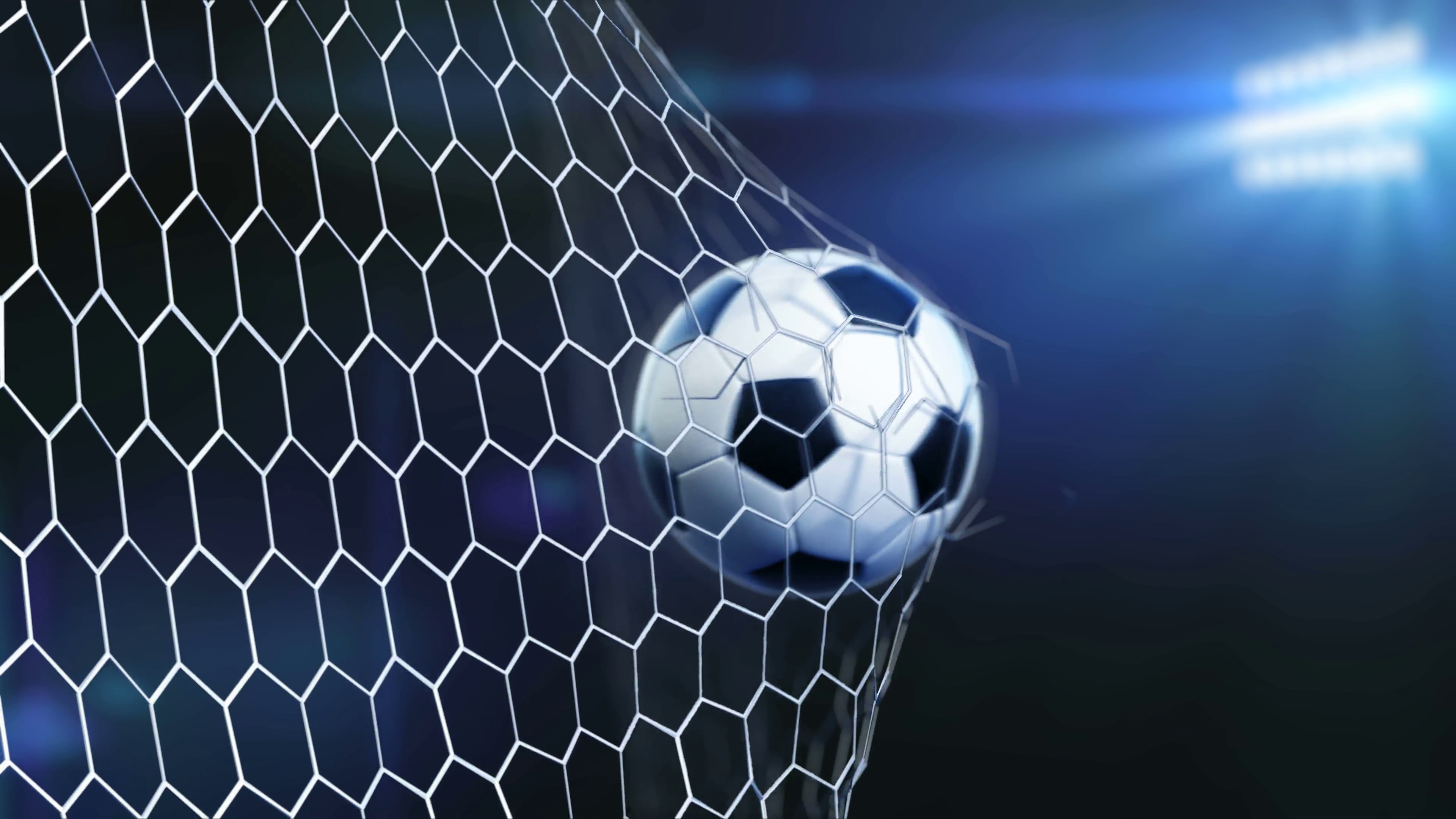 3840x2160 4K slow motion 3d animation of soccer ball flying and tearing goal net on  dark background
