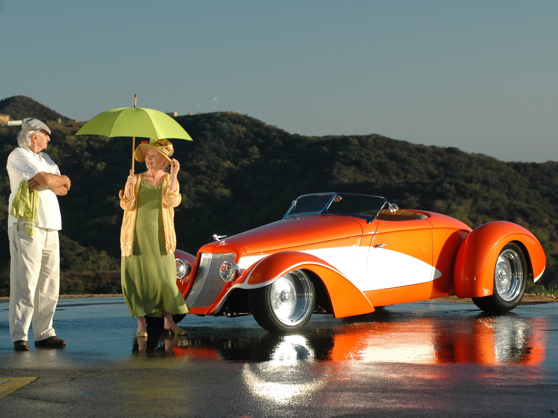 1920x1440 Deco Rides Boattail Speedster by Chip Foose - Man & Woman with Umbrella -   Wallpaper