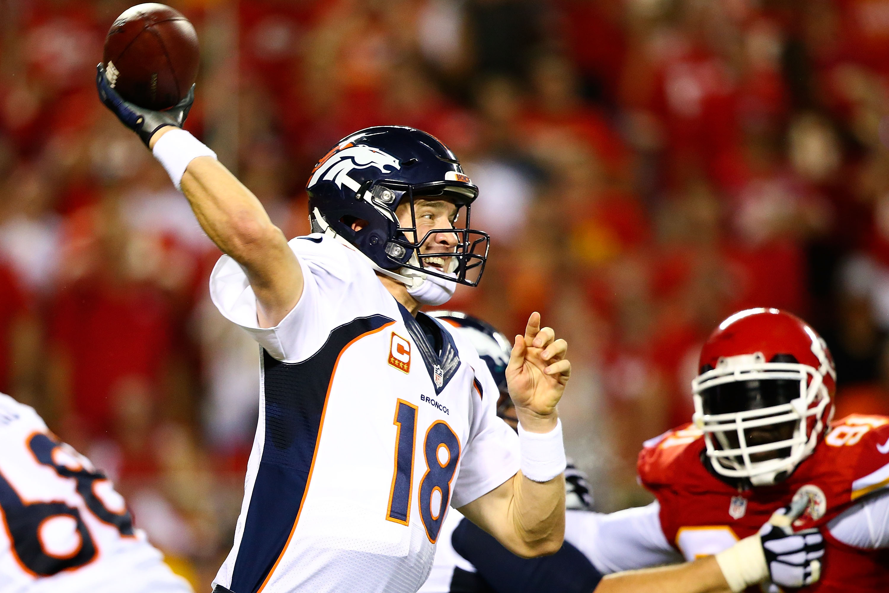 3000x2000 Peyton Manning #18 of the Denver Broncos throws a pass during the game  against the