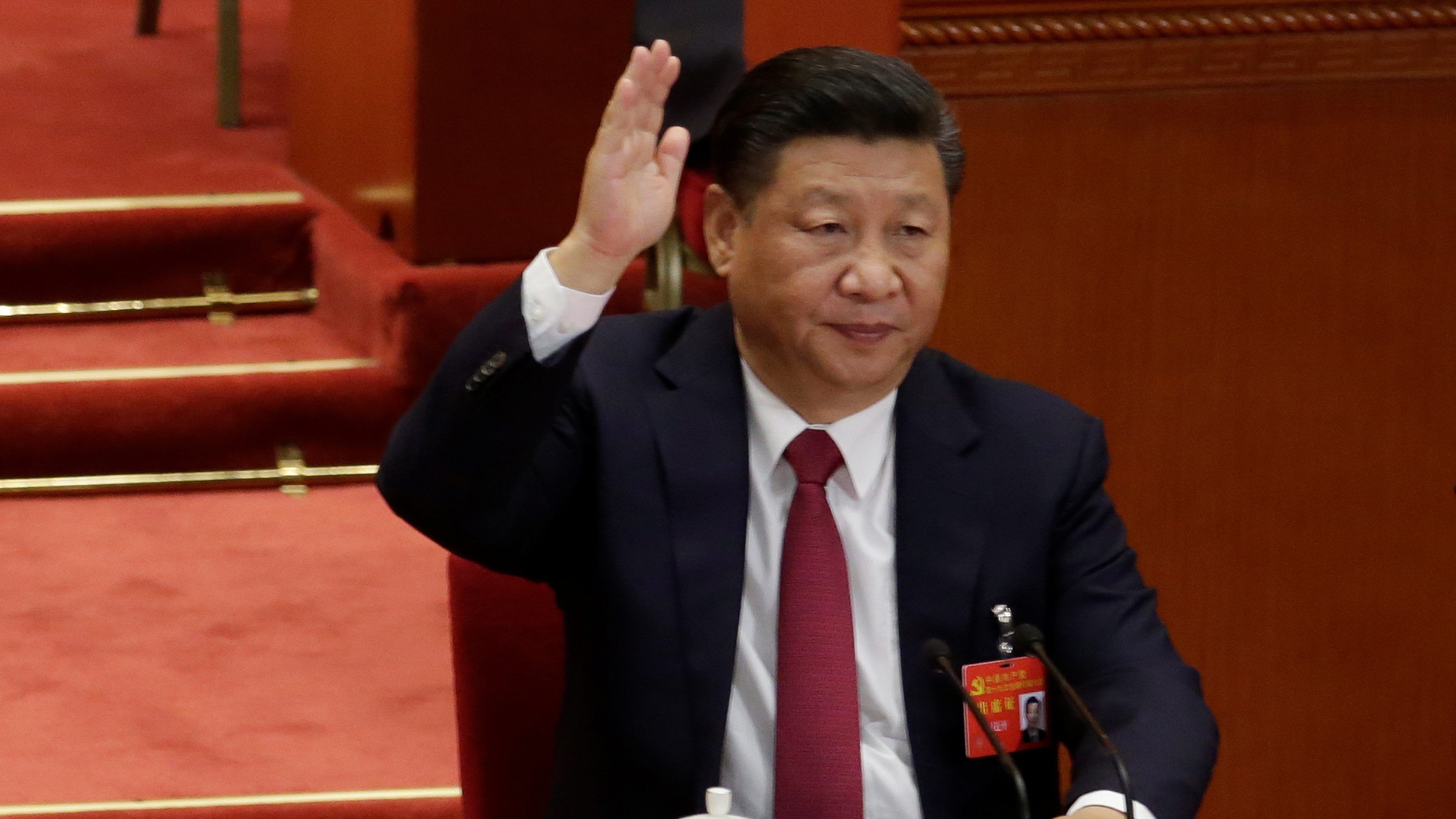 3600x2025 Chinese President Xi Jinping raises his hand as he takes a vote at the  closing session