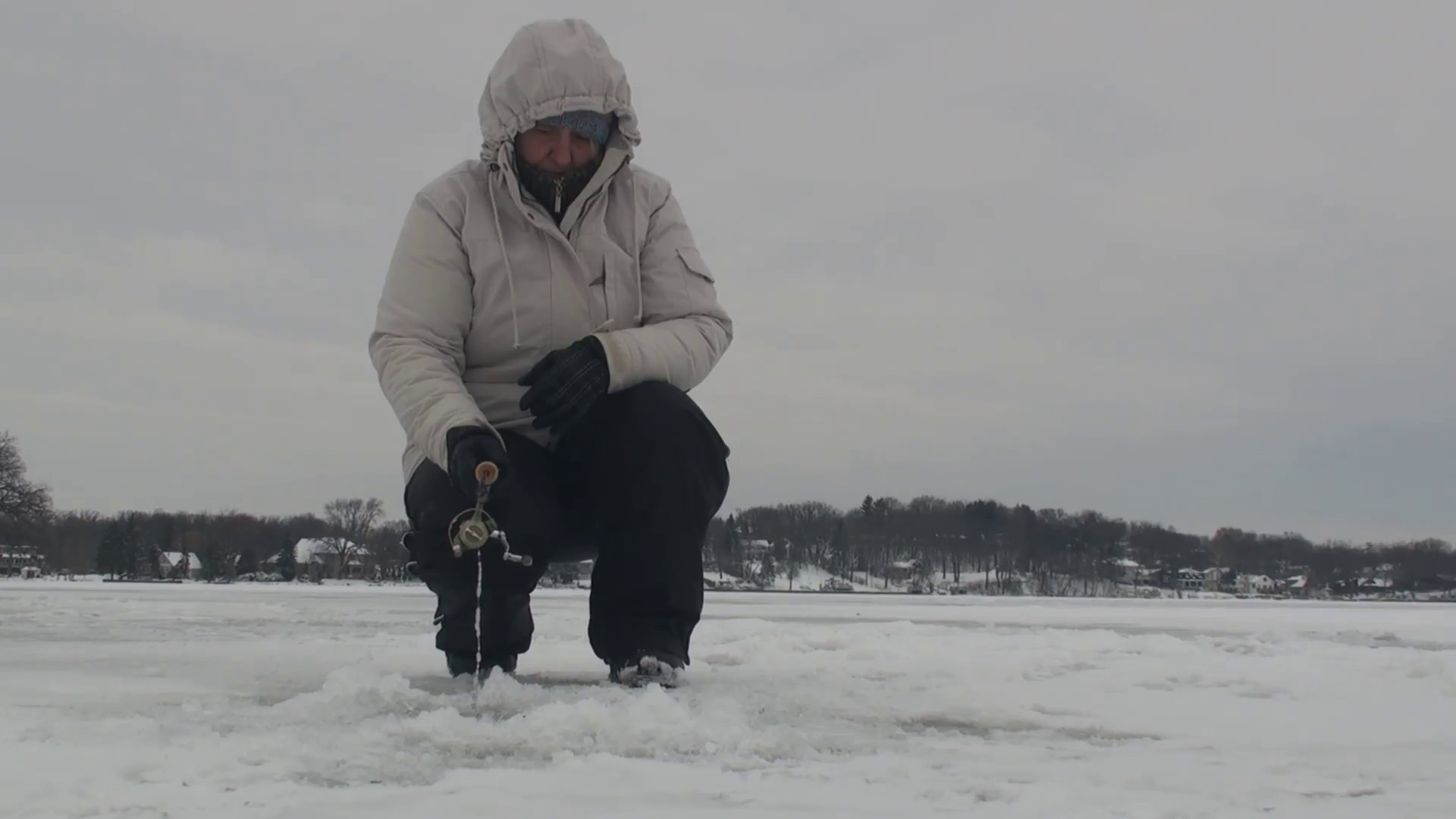 1920x1080 Woman ice fishing on the frozen lake 2 Stock Video Footage - Storyblocks  Video