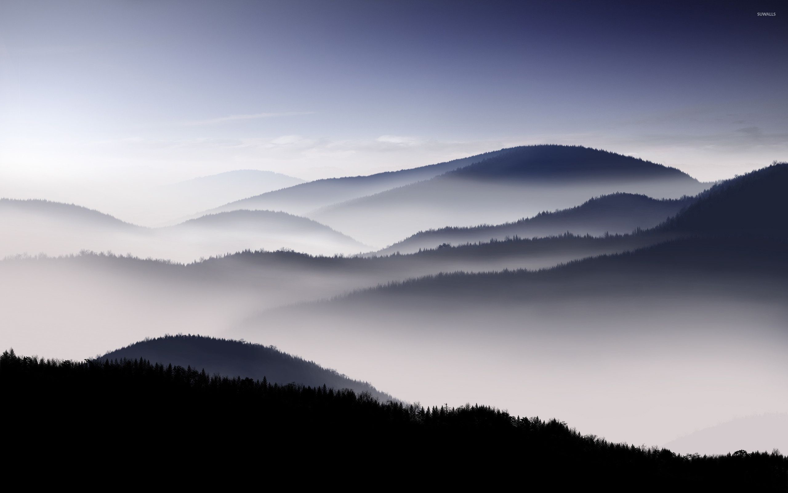 2560x1600 Fog covered mountain range wallpaper