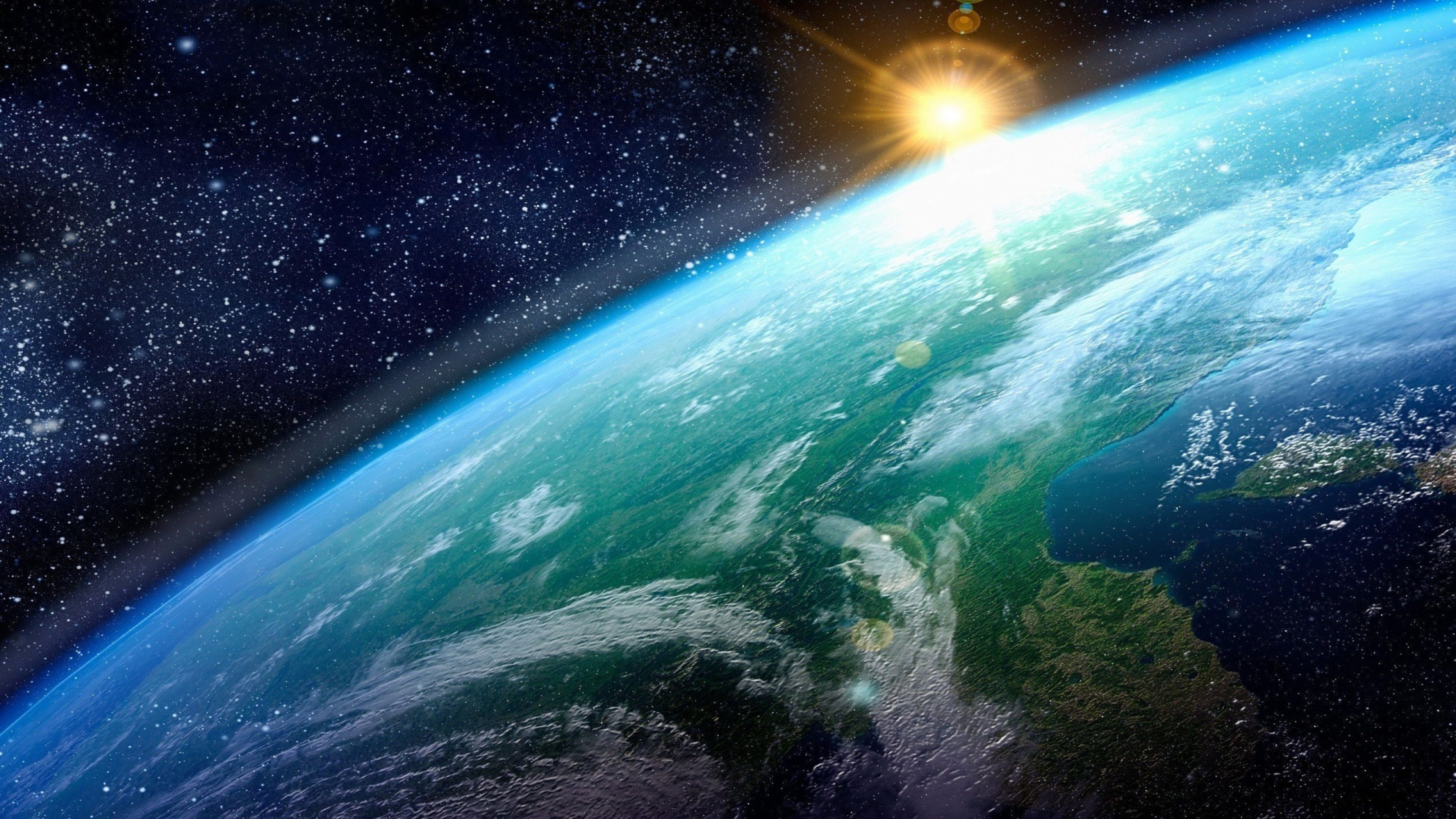 3840x2160 Preview wallpaper earth, sun, planet, surface, stars 
