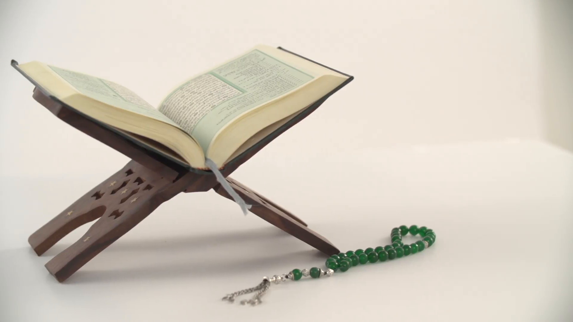 1920x1080 Prayer beads with Holy Quran on stand. Stock Video Footage - Storyblocks  Video