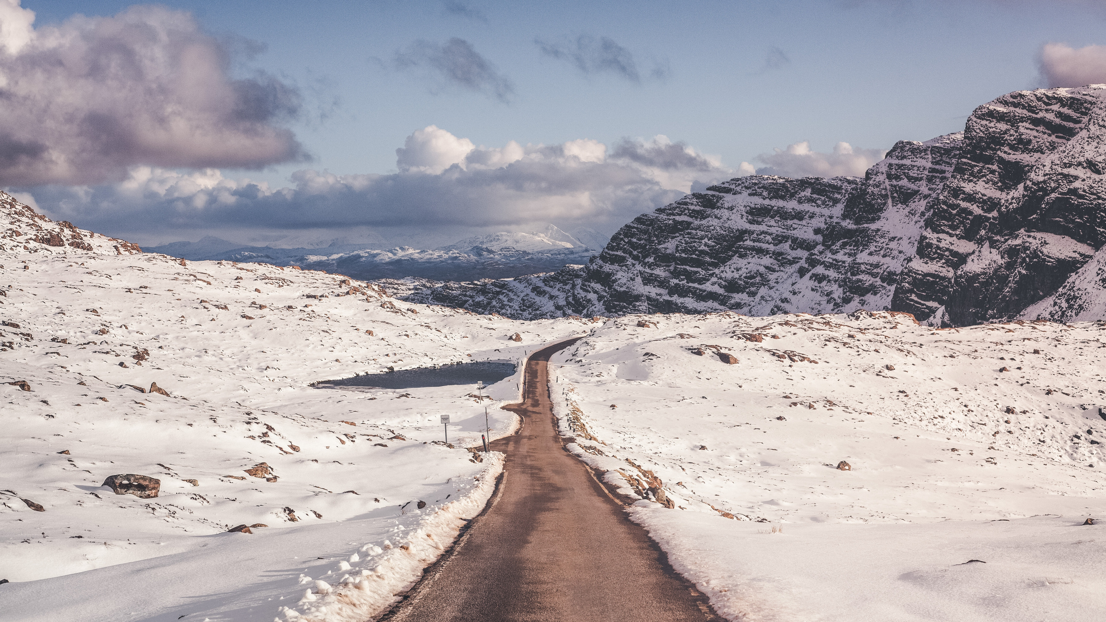 3840x2160 Preview wallpaper snow, mountains, road, turn 