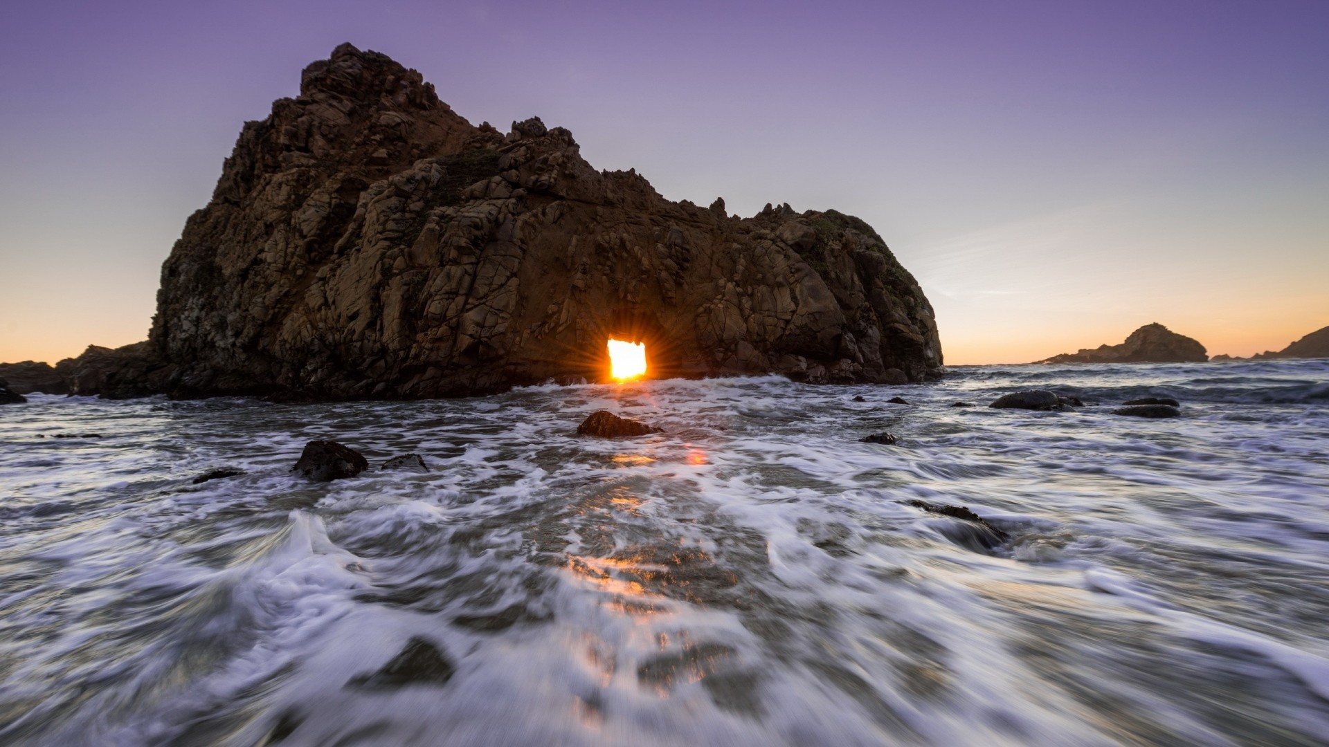 1920x1080  Wallpaper sea, ocean, rock, light, sunset
