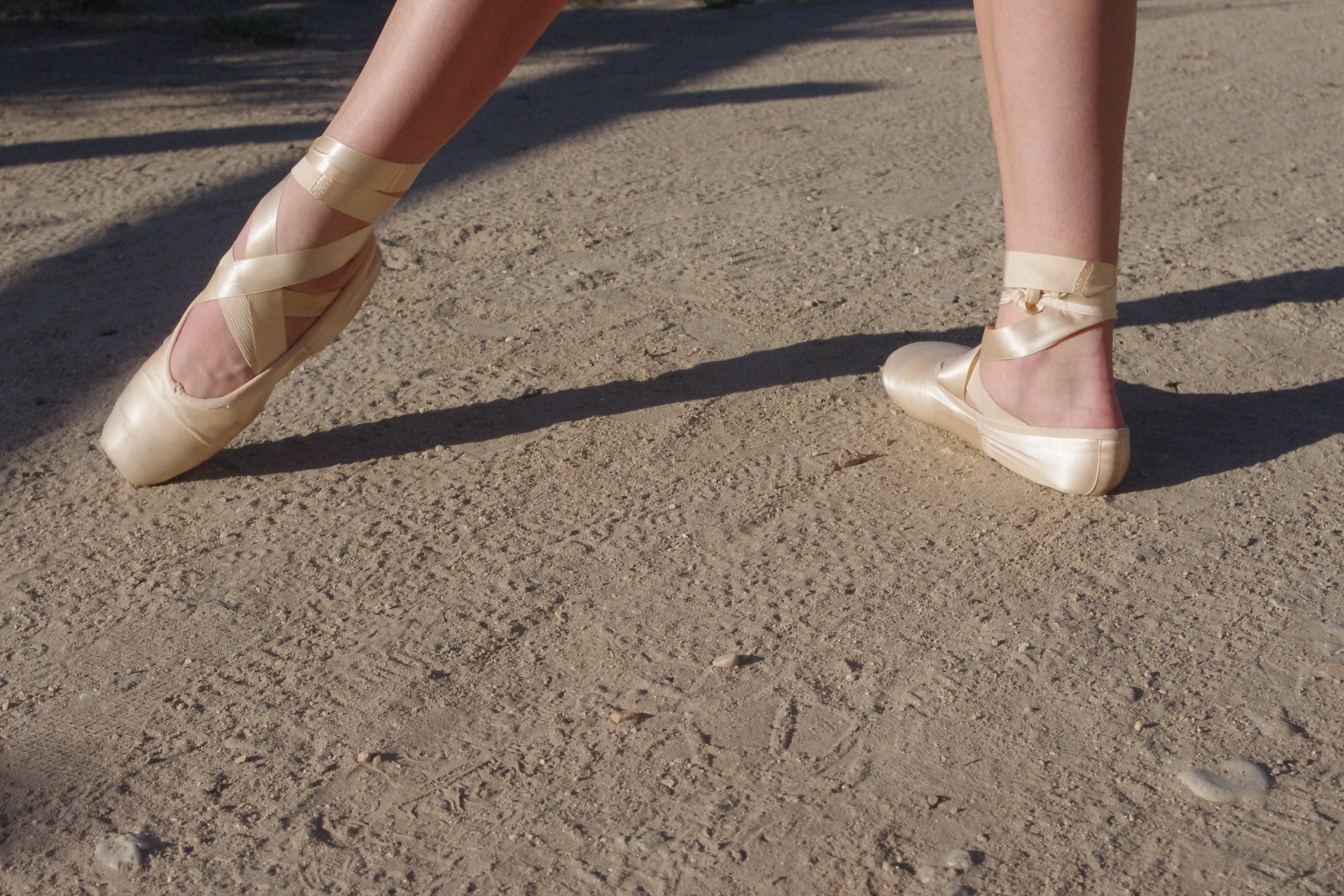 3072x2048 women's pair of beige ballet shoes