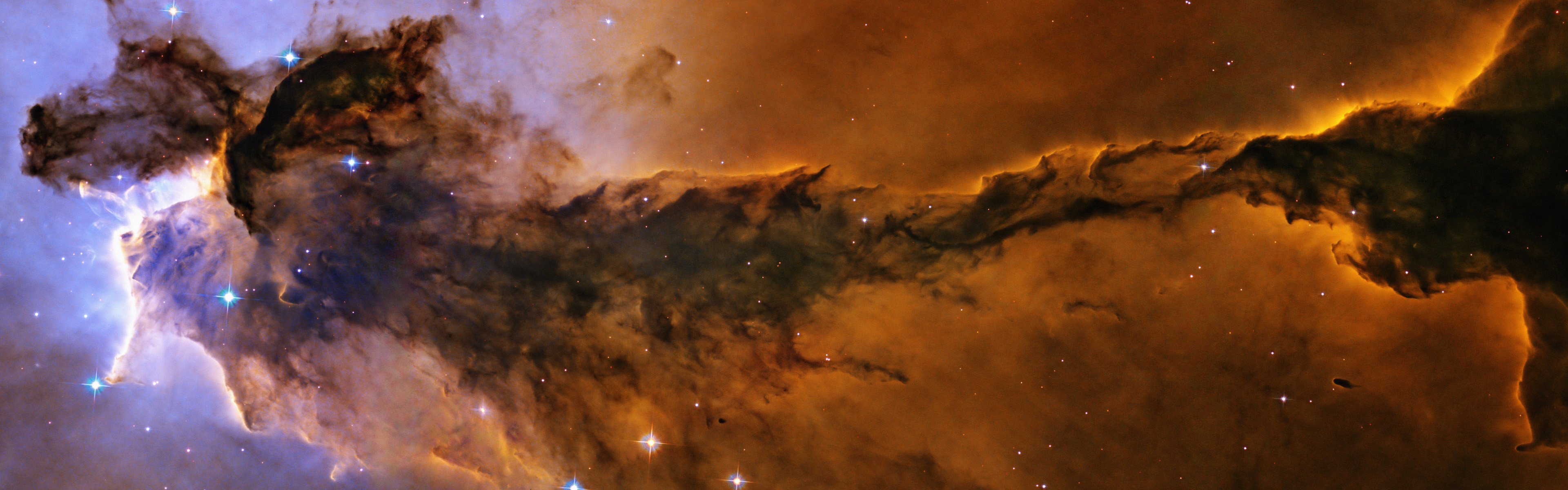 3840x1200 Billowing tower of cold gas and dust rising from the Eagle Nebula .