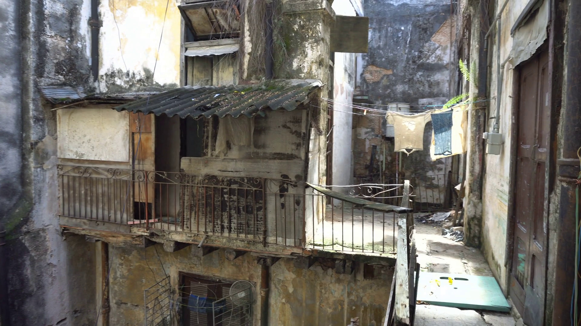1920x1080 Inside the courtyard of old battered dirty house in a slum into ghetto  downtown at Havana Stock Video Footage - VideoBlocks