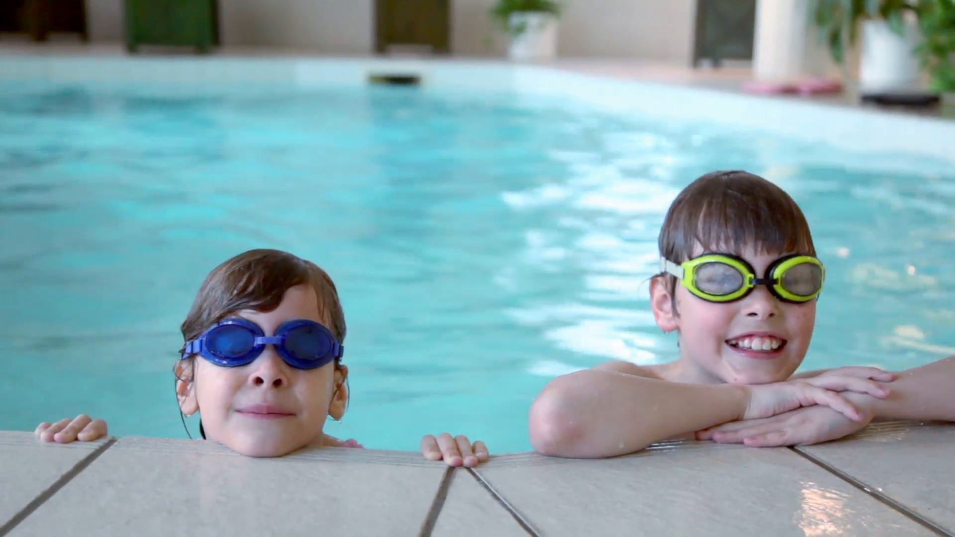 1920x1080 Two kids in swimming glasses stay on pool edge Stock Video Footage -  VideoBlocks