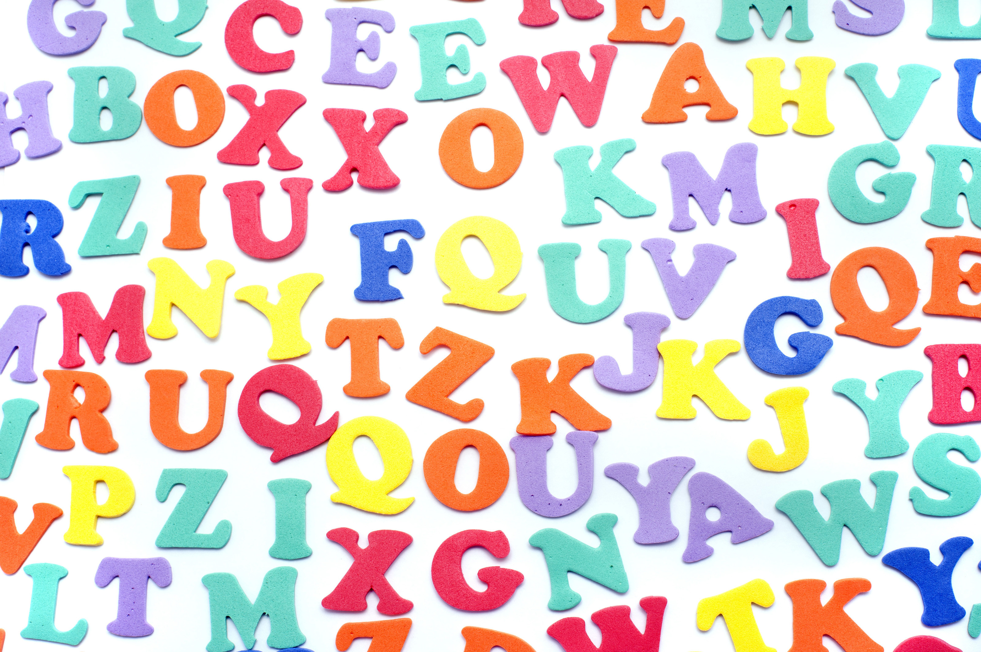 3200x2129 Array of colourful alphabet letters in uppercase on a white background for  teaching children languages