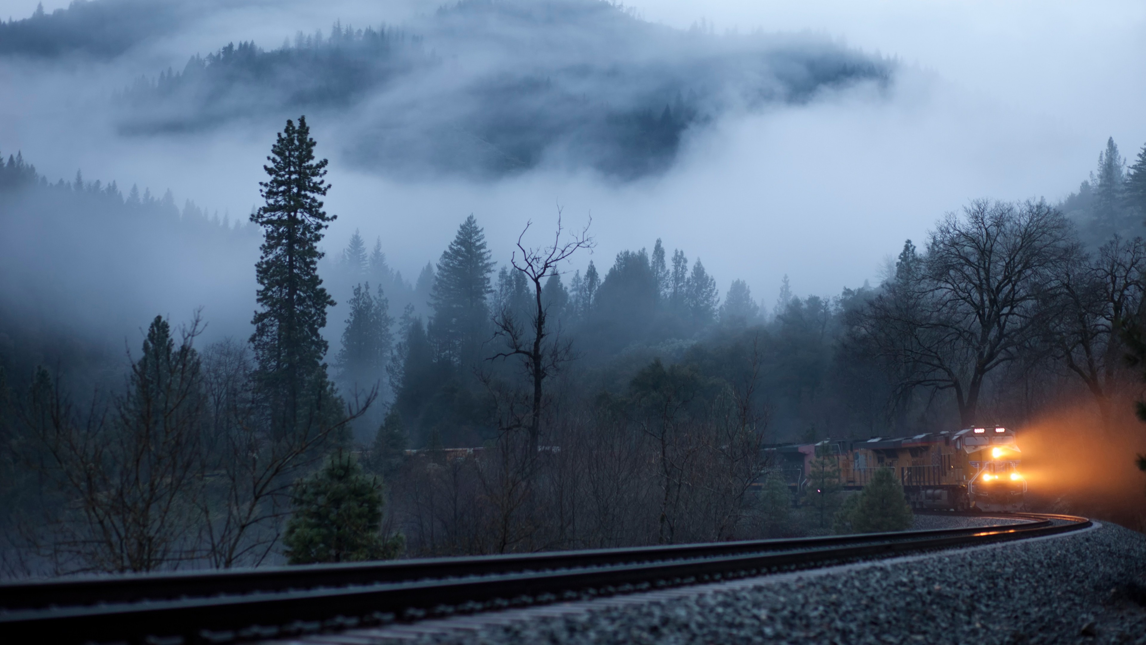 3840x2160 Preview wallpaper train, fog, railroad, light, trees 