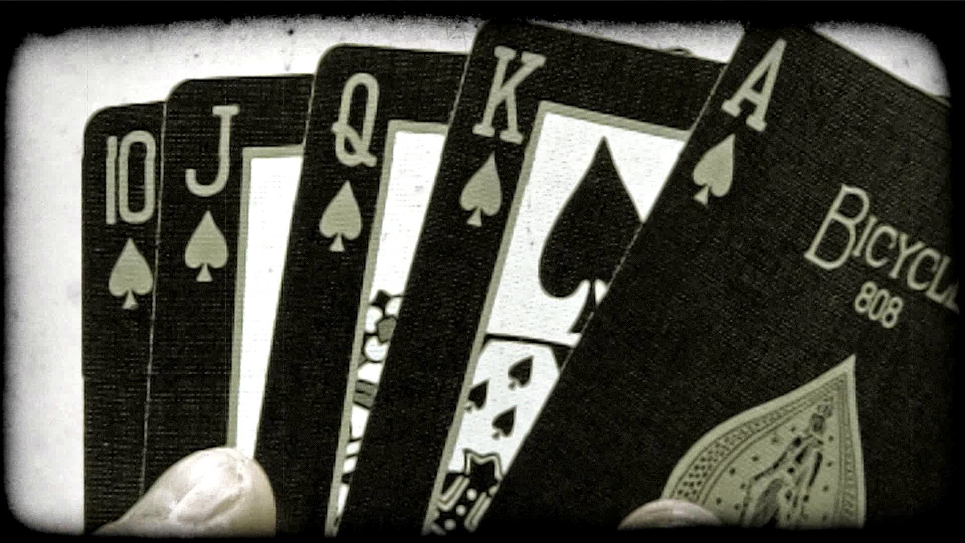 1920x1080 A royal flush of spades folded out from behind an ace. Vintage stylized  video clip.