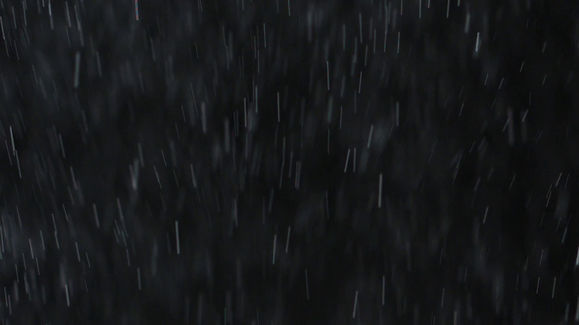 1920x1080 Falling raindrops or snow against a black background. Close-up shot Stock  Video Footage - VideoBlocks
