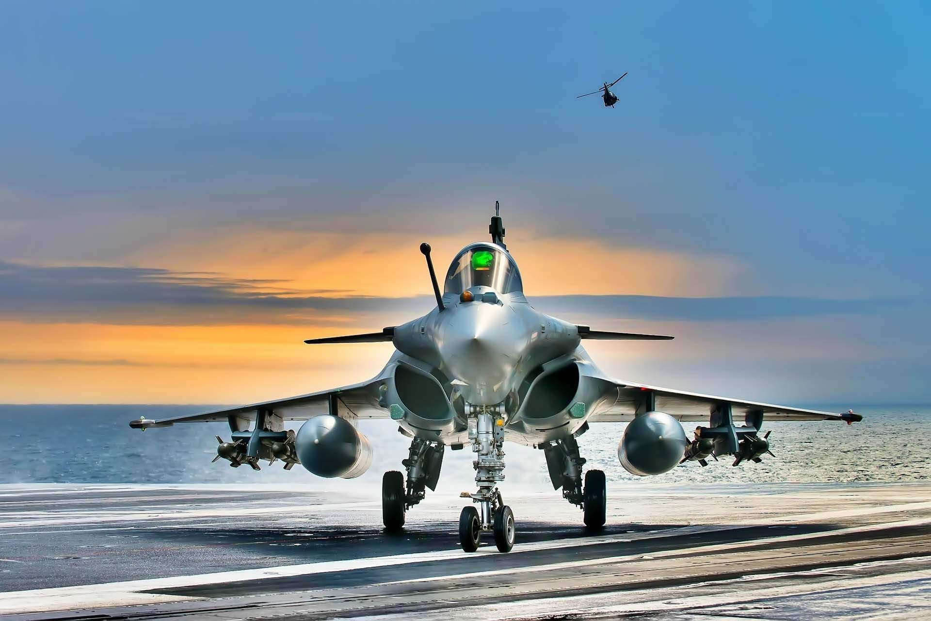1920x1280 Rafale- the sexiest fighter aircraft today.on the deck of aircraft carrier  with sunset on the background