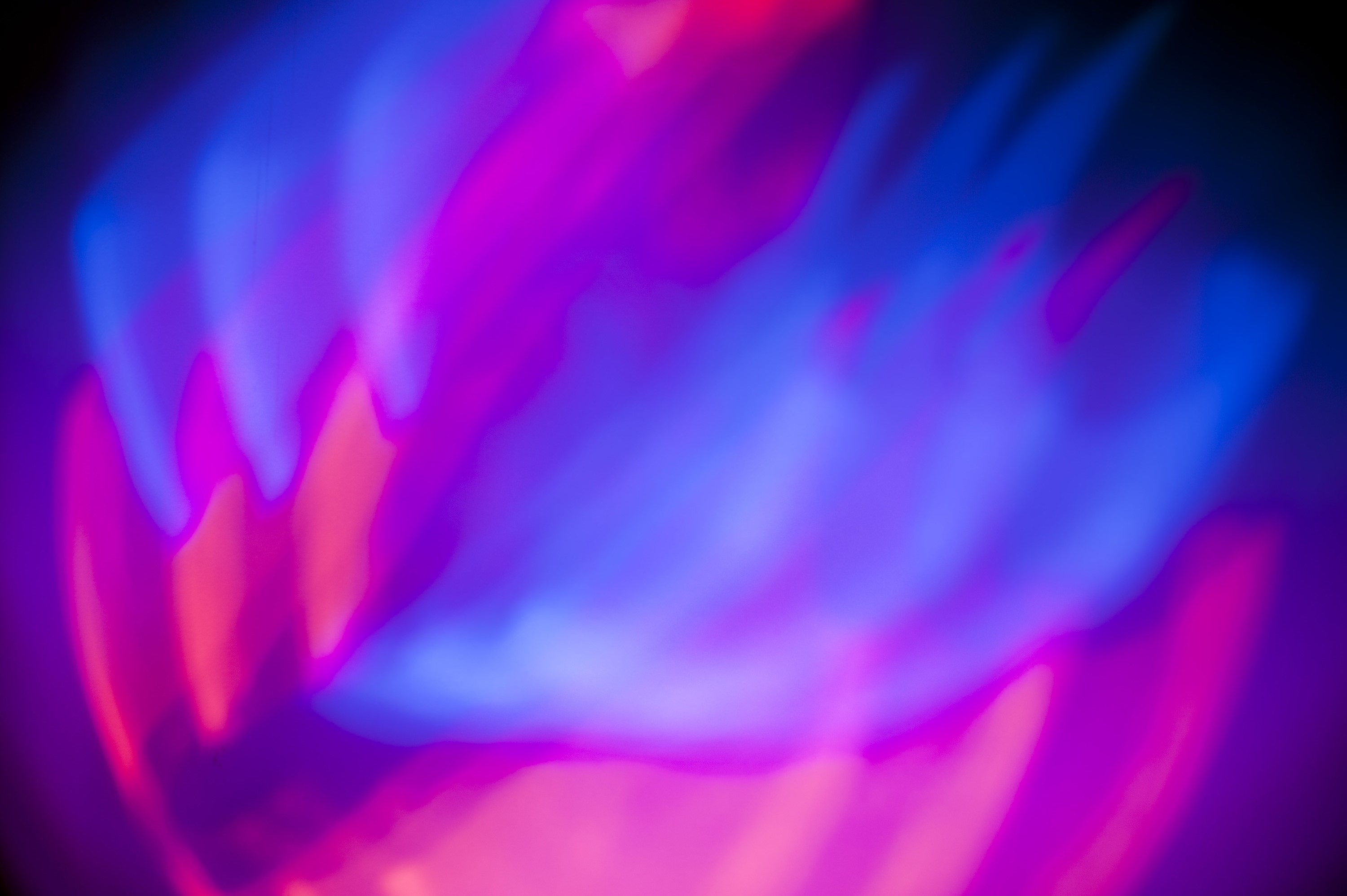 3000x1996 abstract flame like red and blue background of mixing light beams