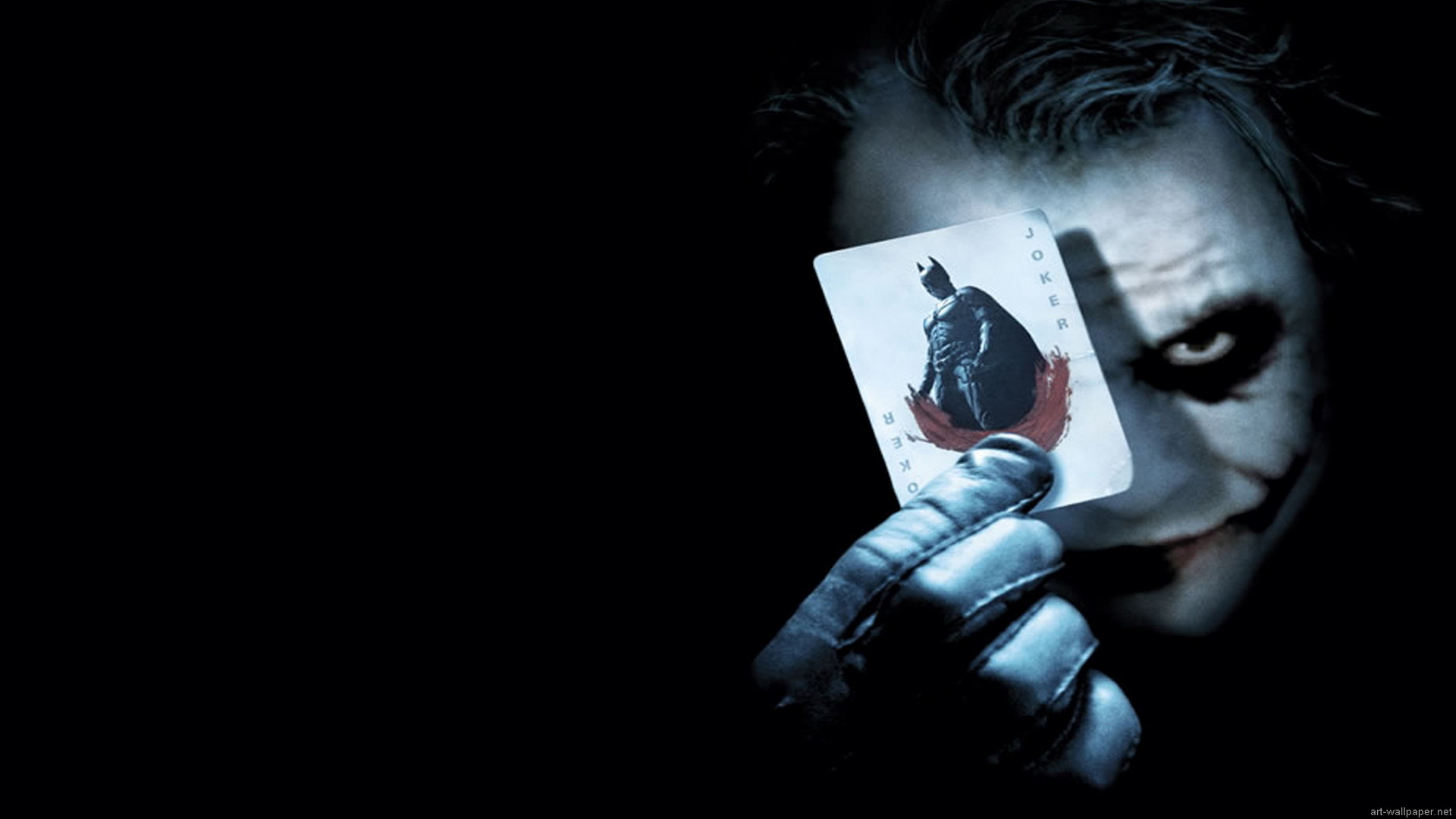 1920x1080 This poster if for the Batman the Dark Knight move. The jokers face and the  playing card he is holding are light colored over a dark background.