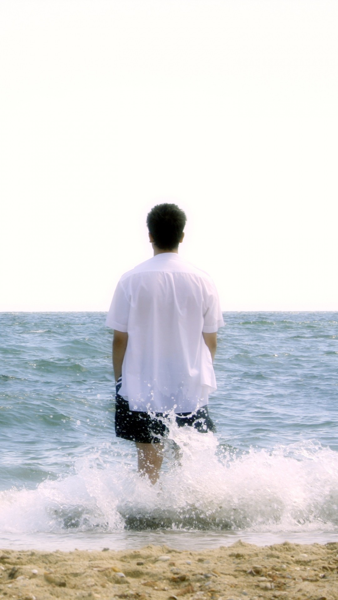 1080x1920  Wallpaper boy, beach, sea, foam, harmony, meditation