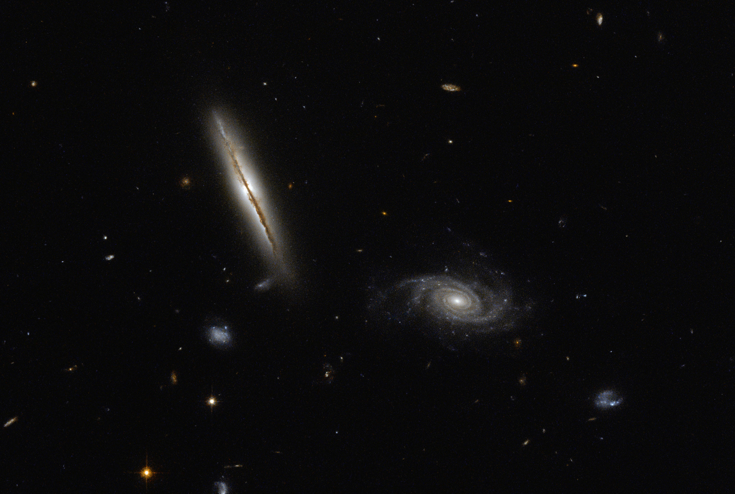2402x1616 Hubble Space Telescope image of spiral galaxies LO95 0313-192 (left) and [