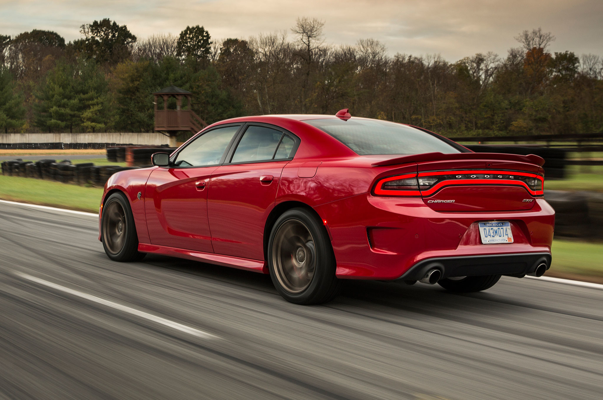 2048x1360 2015 dodge charger srt hellcat rear three quarter view in motion 9