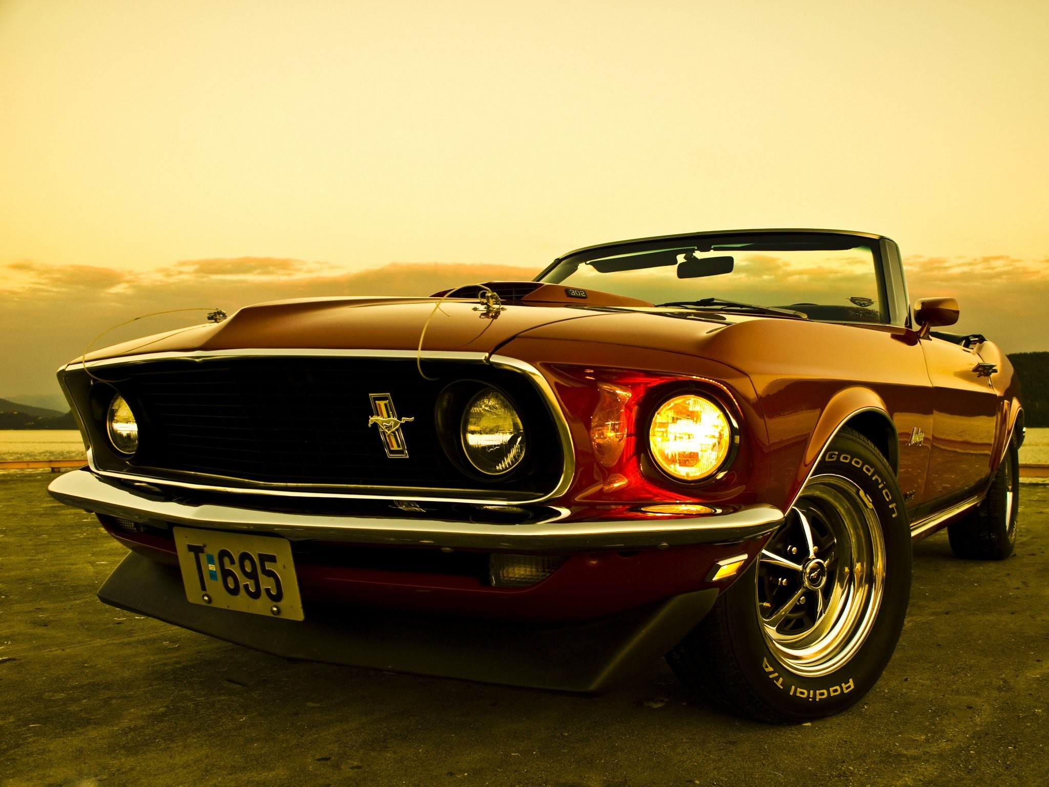 Premium Photo | An old mustang is sitting in a garage