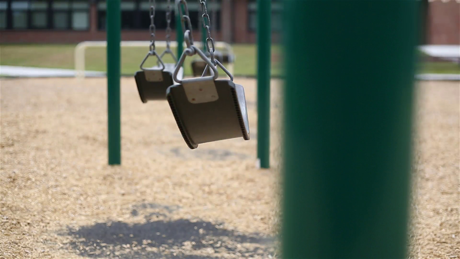 1920x1080 Swing Fast School Background Selective Focus. a long shot with shallow  depth of field on a row of swings with a school in the background. closest  swing ...
