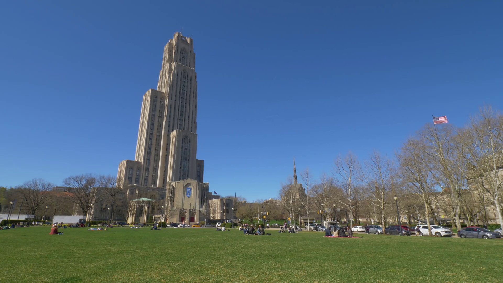 1920x1080 PITTSBURGH - Circa April, 2017 - A daytime establishing shot of the  Cathedral of Learning on Pitt's campus on a sunny early Spring day.