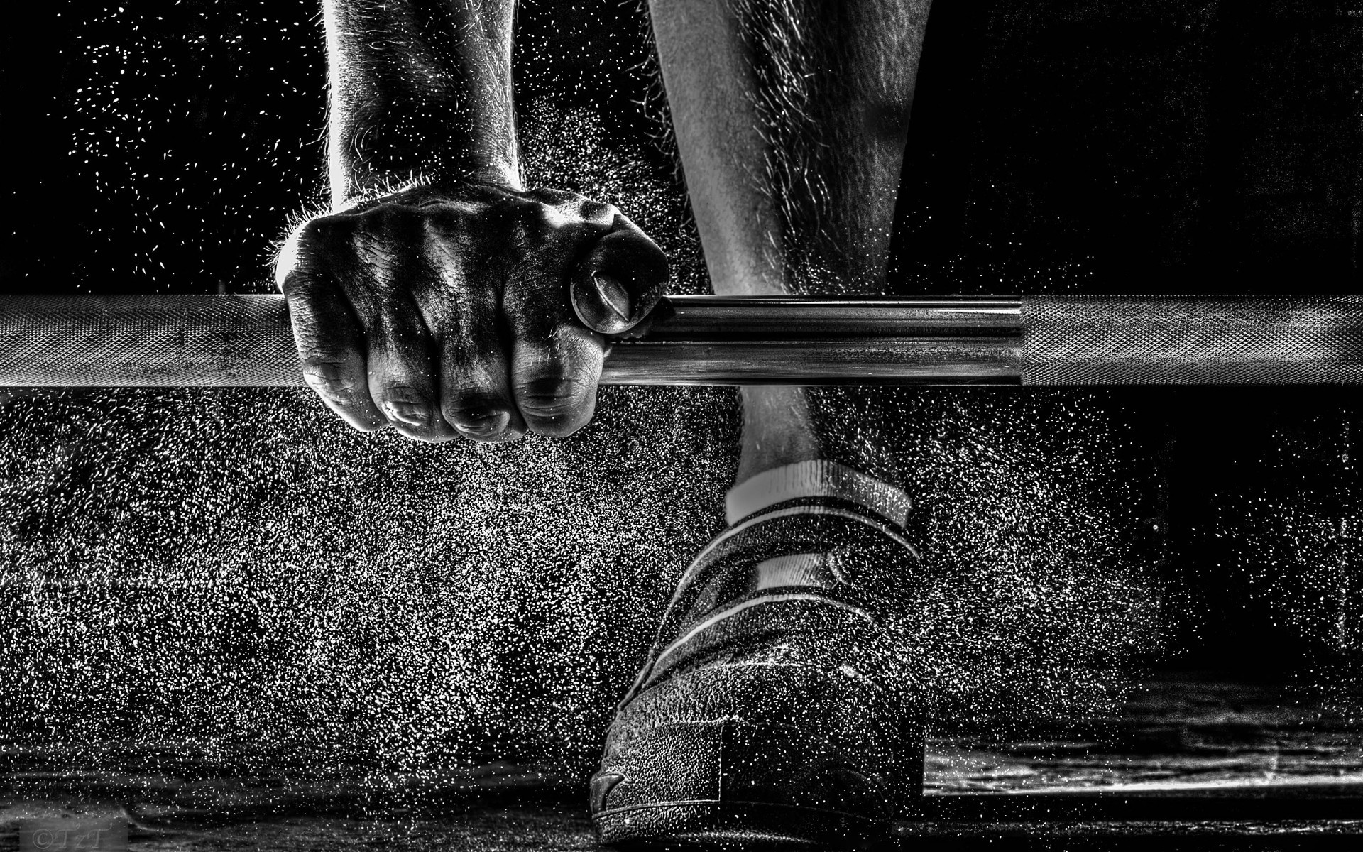 1920x1200 A Man Training Weight Lifting Barbell With Dust Flying Over His Shoes Black  And White