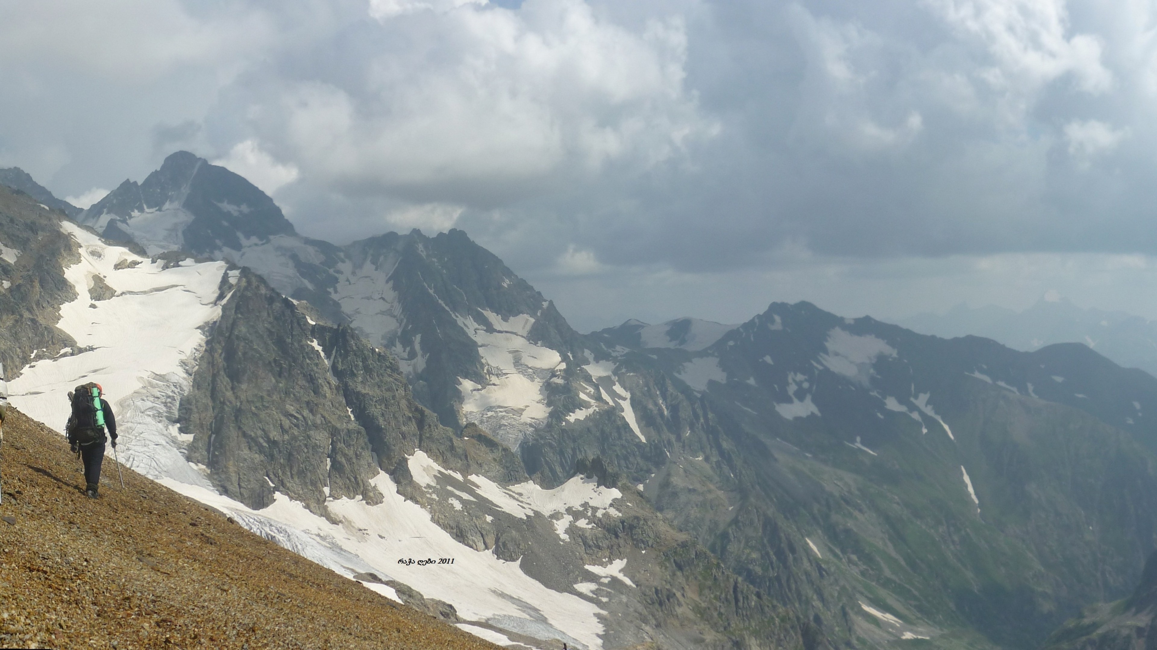 3840x2160 Preview wallpaper panorama, mountains, person, ascension, climber,  loneliness 