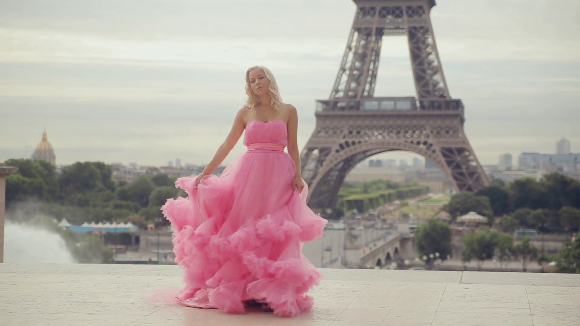 1920x1080 Tender girl in a pink dress with a long hem spinning near the Eiffel Tower  in Paris Stock Video Footage - Storyblocks Video