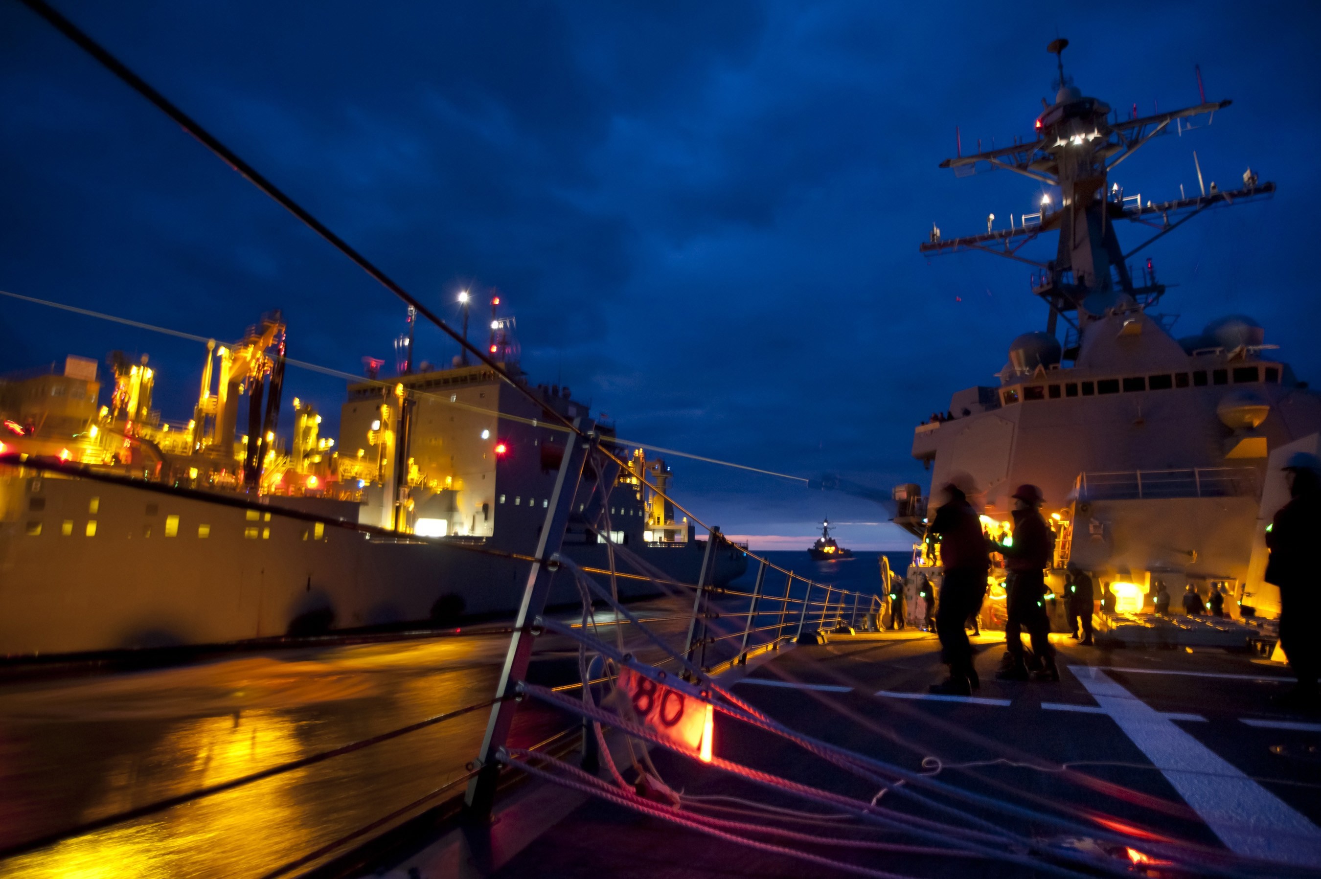 2700x1797 Sailors fire shot lines from the destroyer Gridley. // MC2 James Evans