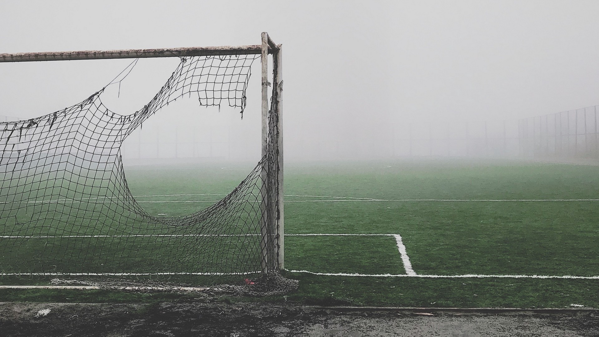 1920x1080  Wallpaper football gate, torn, fog, lawn, mood, gloomy