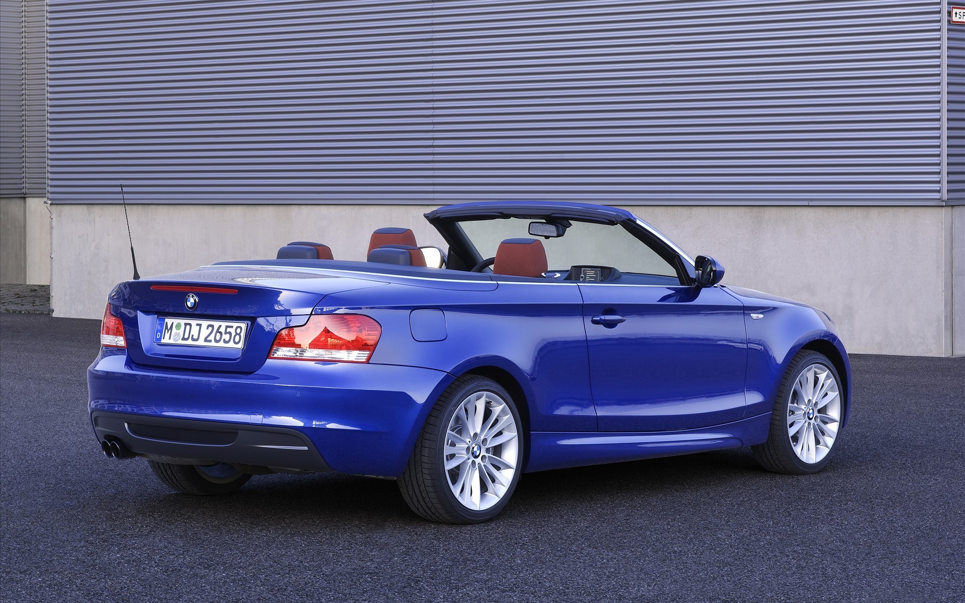 1920x1200 Parked by the wall blue convertible BMW 135i