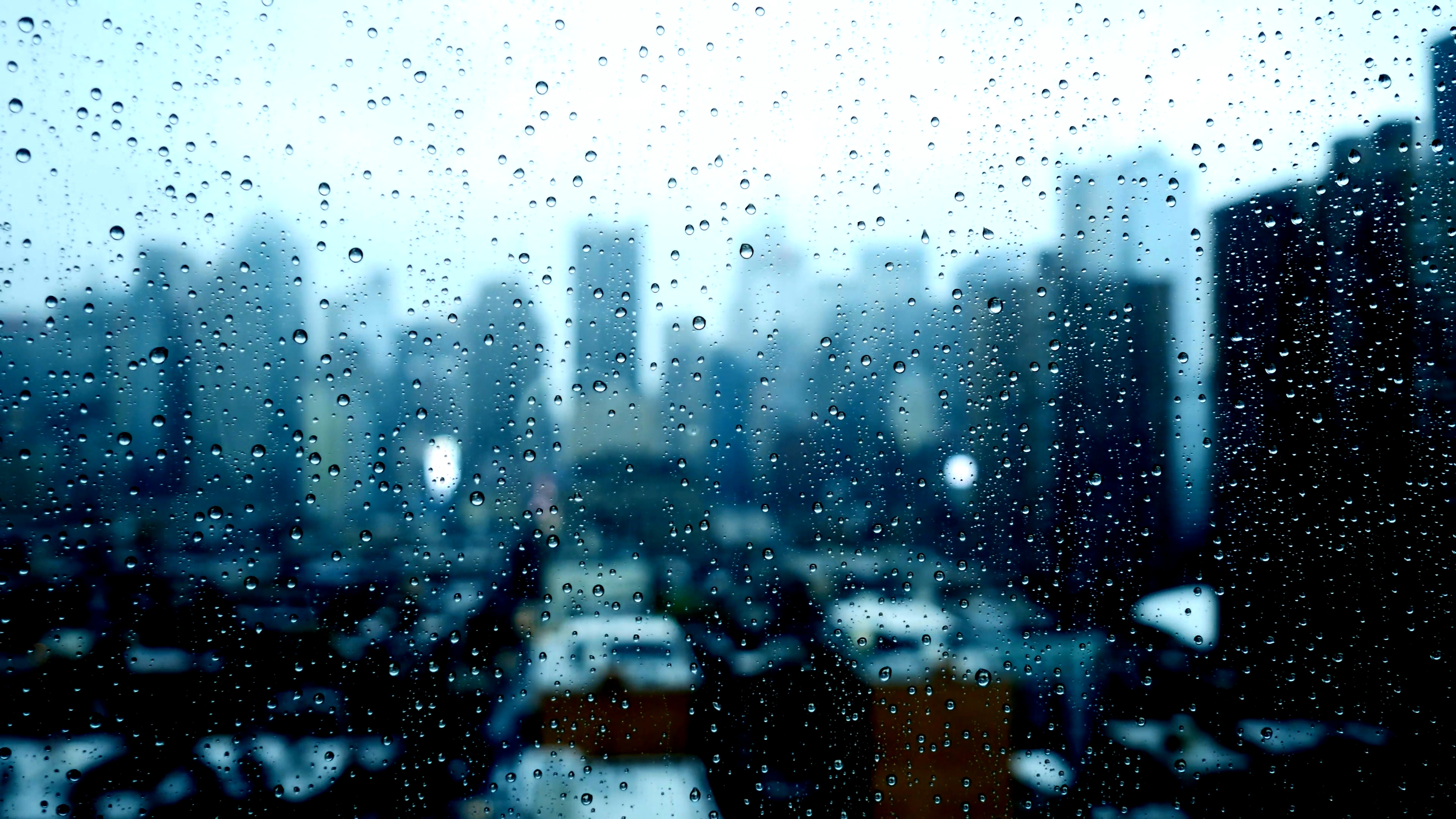 3840x2160 blurry city skyline window view. sad bad weather. rain drops background  Stock Video Footage - VideoBlocks