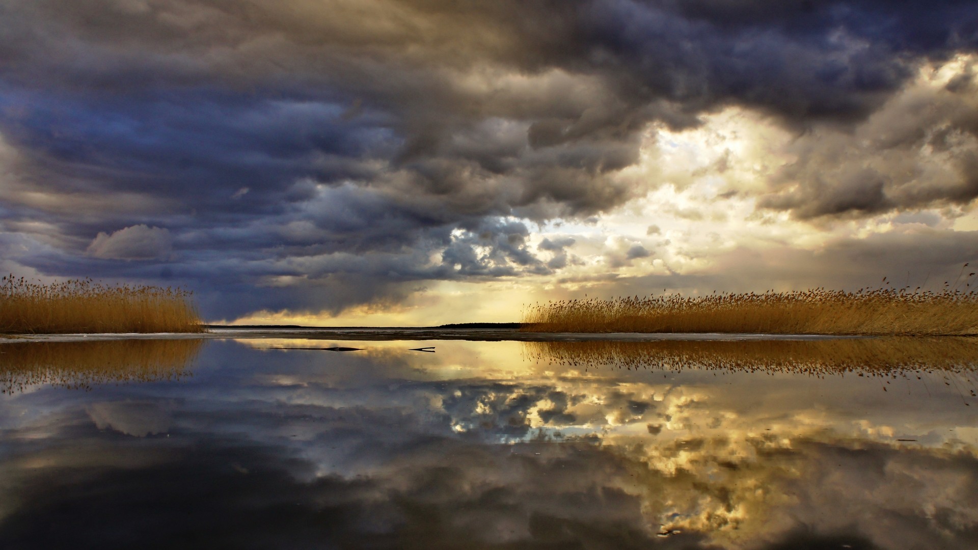 1920x1080 Storm Clouds Reflected On A Lake HD Desktop Background wallpaper free