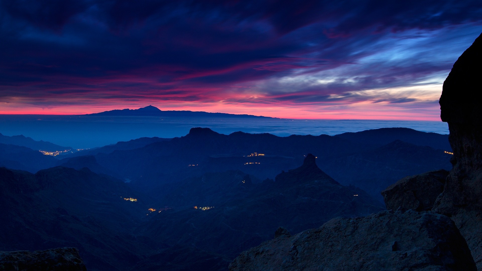 1920x1080 Preview wallpaper mountains, twilight, sky, clouds, fires, distance,  darkness 