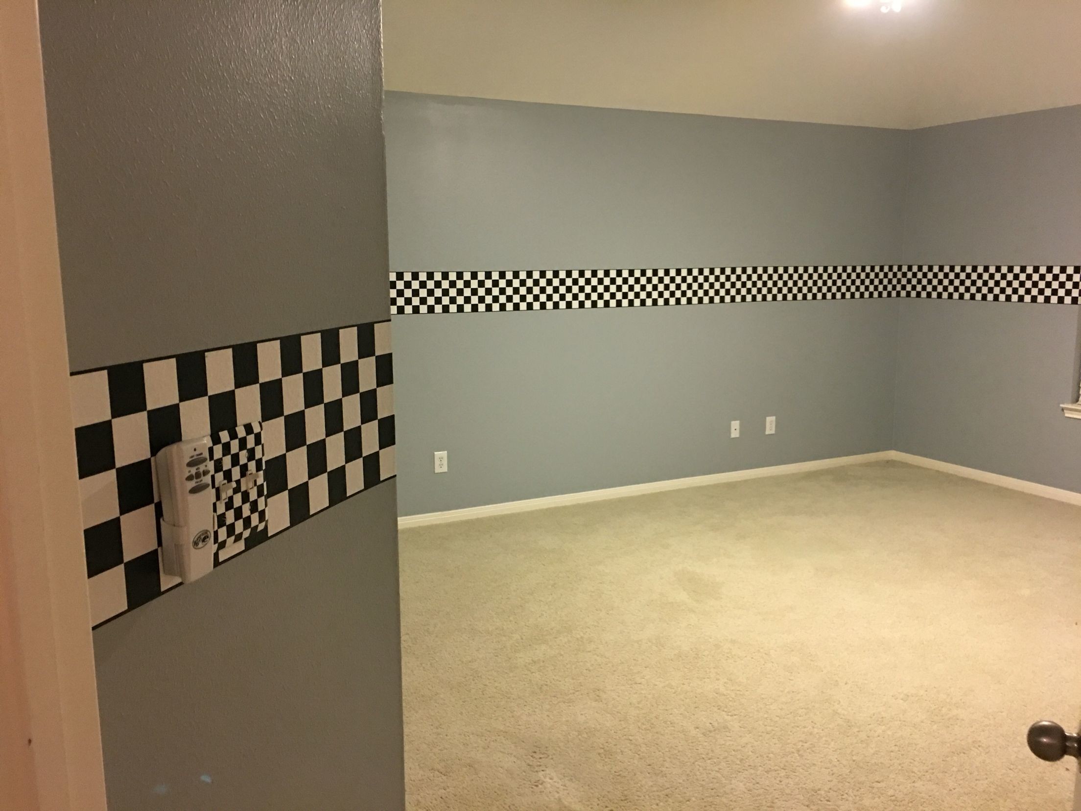 2208x1656 Light grey walls with checkered flag ribbon wallpaper border and checkered  flag light switch