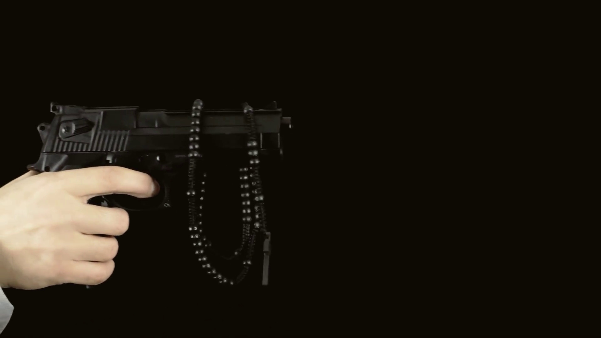 1920x1080 Gun rosary hand black background. A hand holding a gun appearing on a black  background