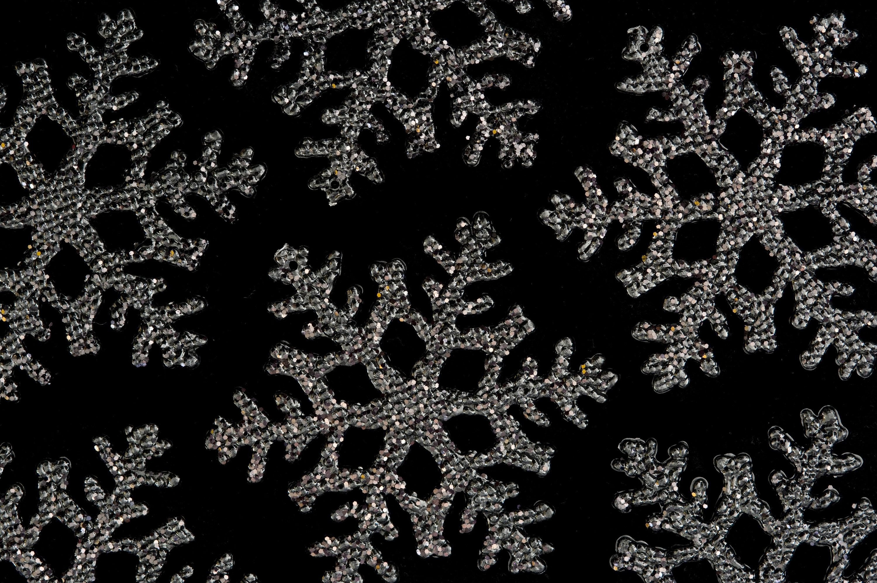 3000x1996 christmas snowflake shape decorations on a black backdrop