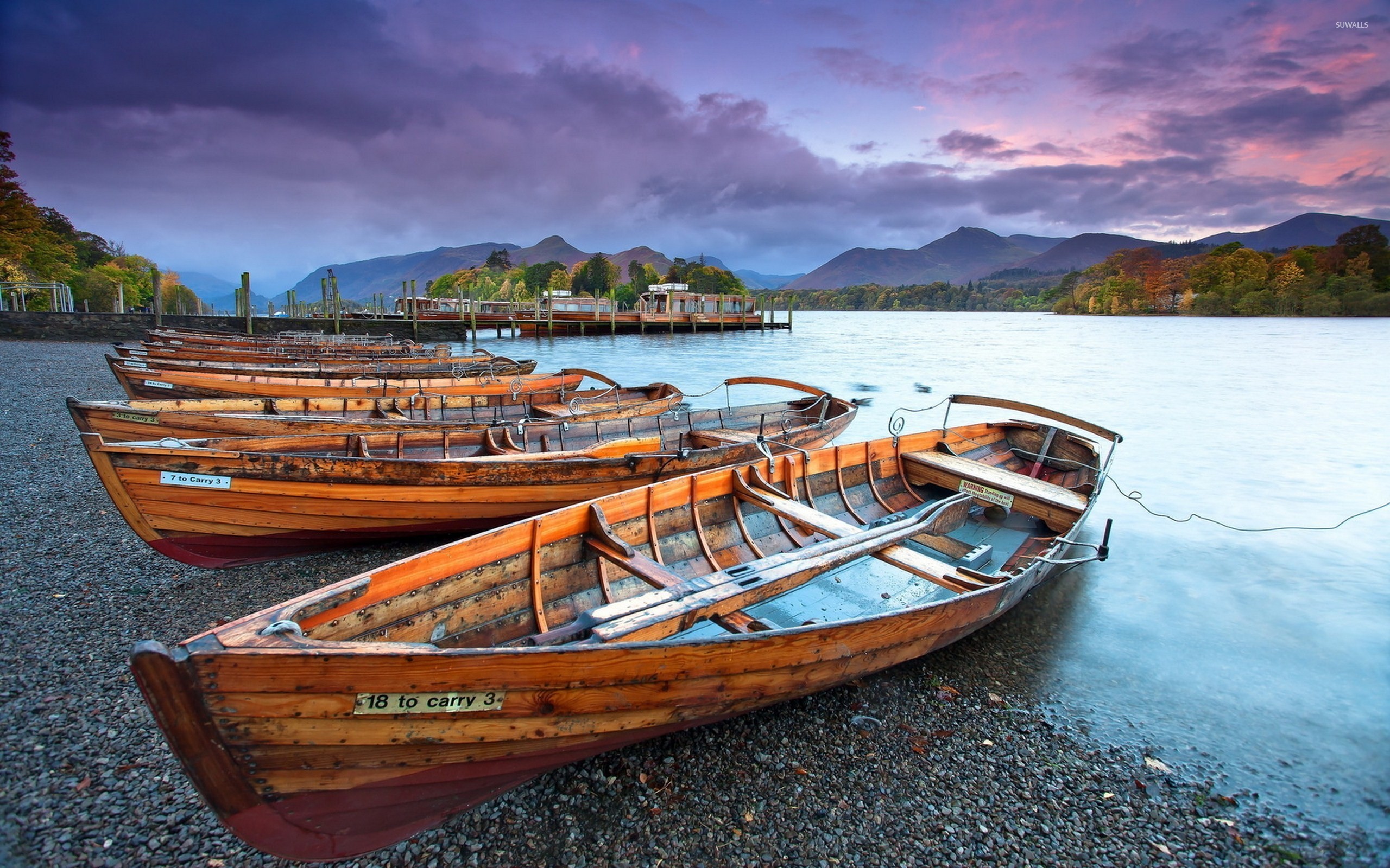 2560x1600 Wooden boats on the pebble beach of the river wallpaper