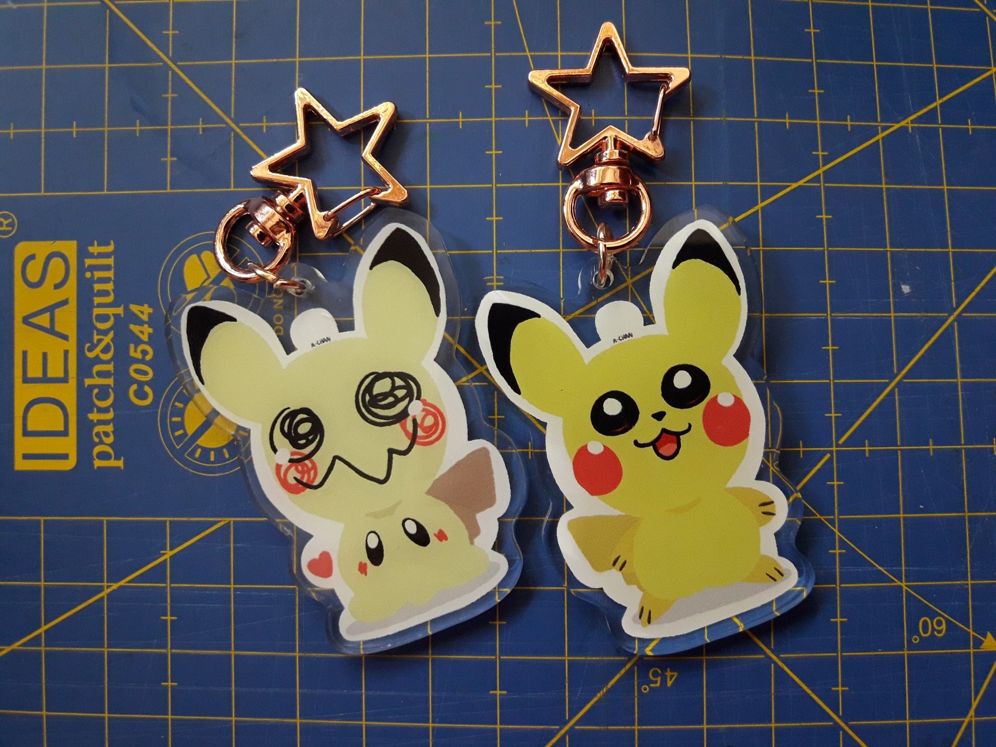 2000x1500 Pikachu and Mimikyu two sided acrylic charm