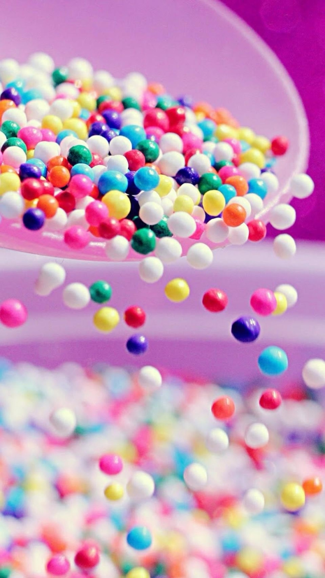 1080x1920 Sweet Colorful Candy Ball Shaking From Bowl iPhone wallpaper