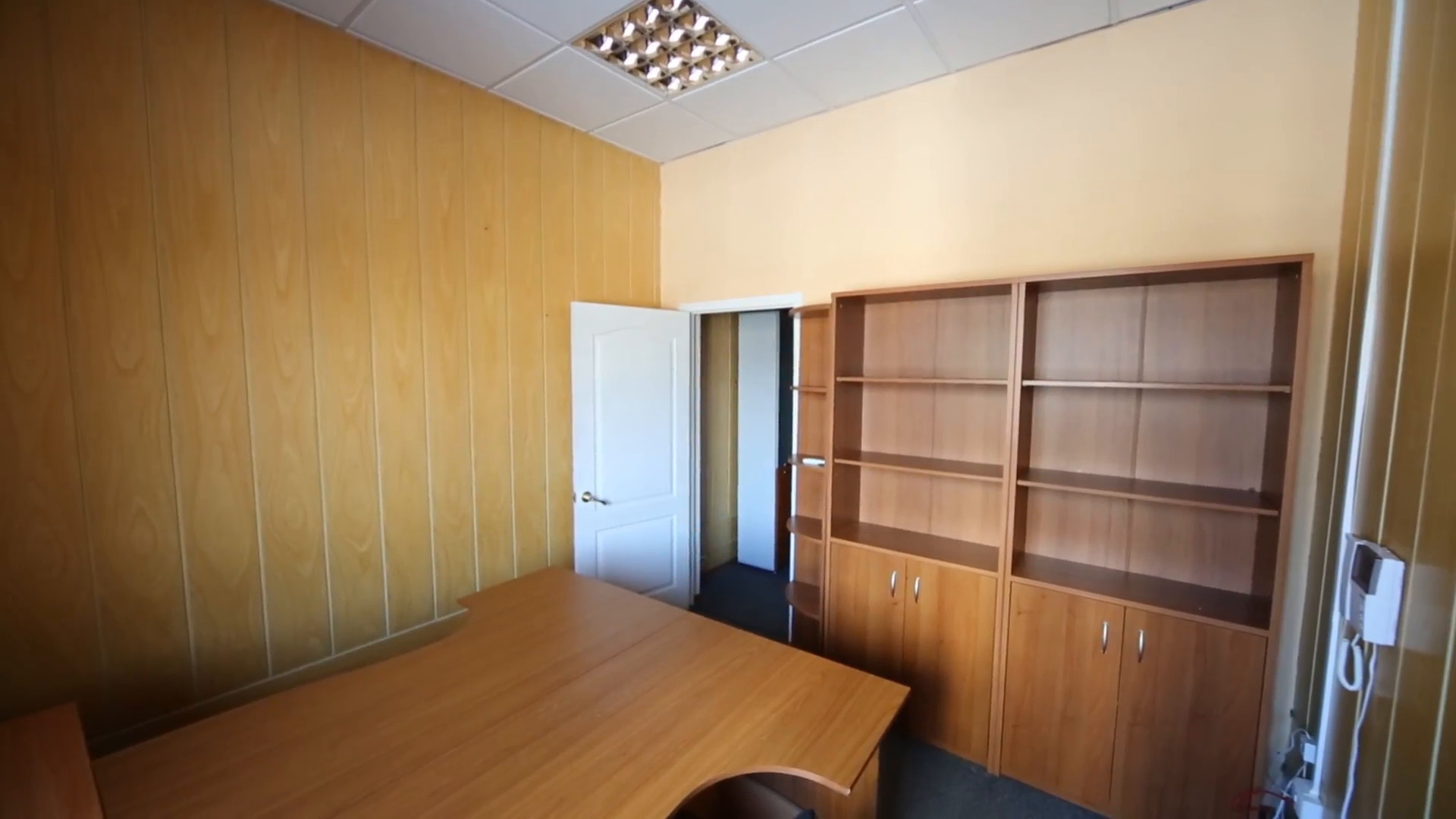 1920x1080 A small office room with a work desk and empty cabinets Stock Video Footage  - VideoBlocks