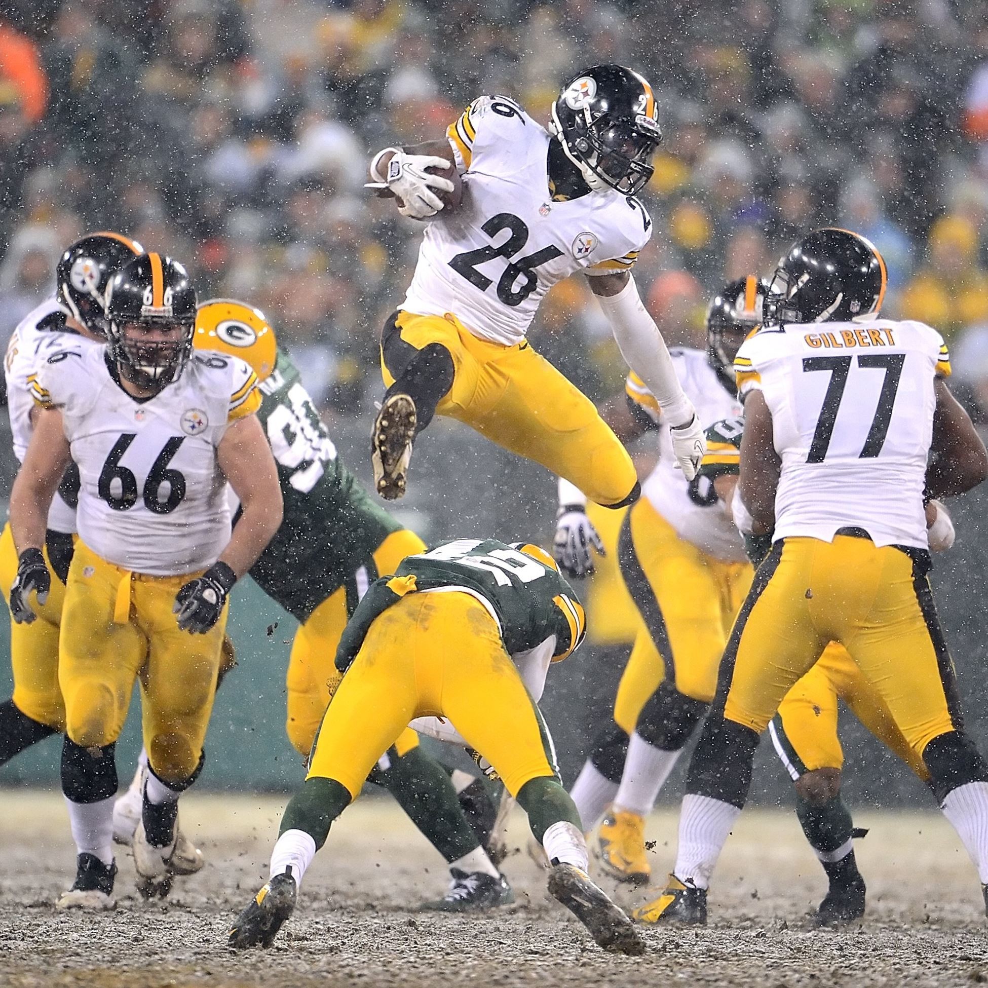 1950x1950 Steelers Le'Veon Bell leaps over Packers Morgan Burnett for first down  yardage in the third quarter at Lambeau Field.