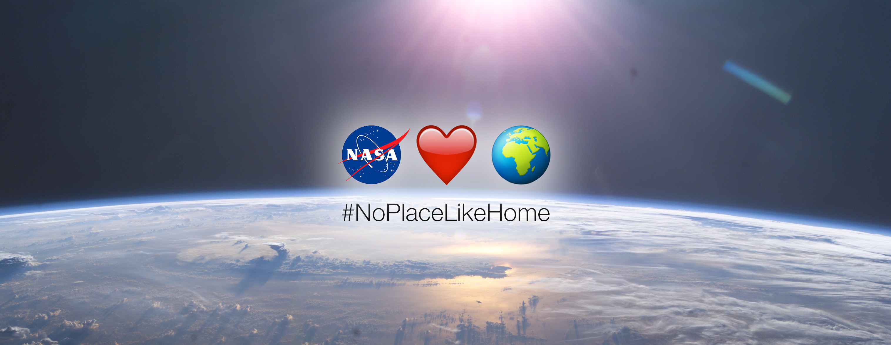 3032x1174 Earth Â· #NoPlaceLikeHome emojis superimposed over an Earth photograph from  the ISS